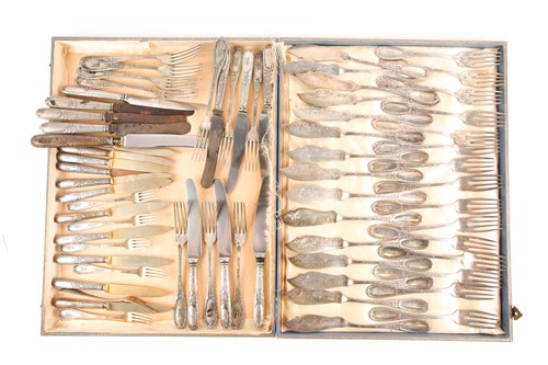 Lot 427 - An early 20th century part-canteen of silver...