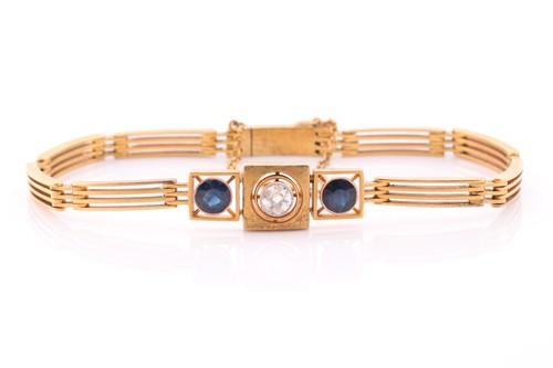 Lot 128 - A yellow metal, diamond, and sapphire bracelet,...