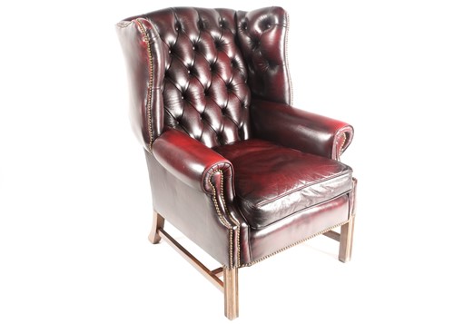 Lot 312 - A George III style deep button "Ox Blood" hide...