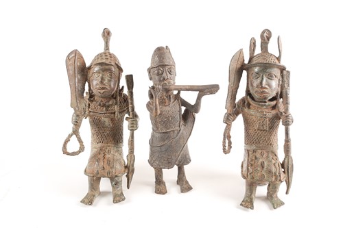 Lot 202 - A pair near of Benin bronze seated warriors,...