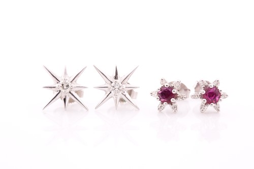 Lot 259 - A pair of diamond and ruby earrings, of floral...