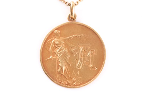 Lot 140A - An Argentinian 18k marked yellow metal pendant...