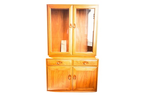 Lot 102 - An Ercol golden dawn light elm two-section...