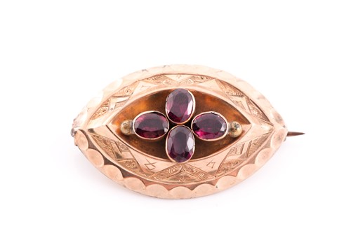 Lot 74 - A Victorian yellow gold and garnet brooch, set...