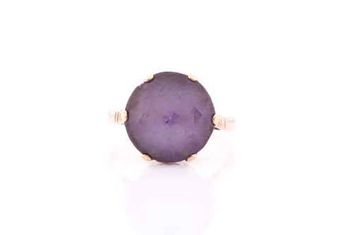 Lot 140 - A singe stone synthetic corundum dress ring;...