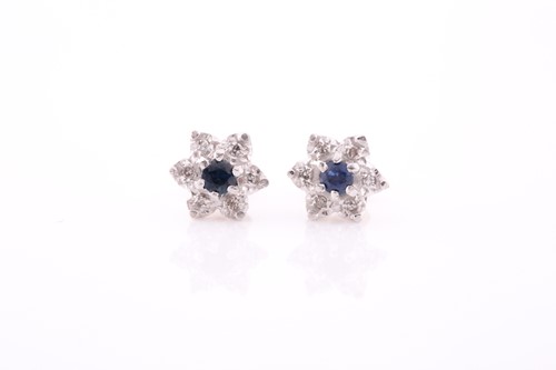 Lot 314 - A pair of diamond and sapphire floral cluster...