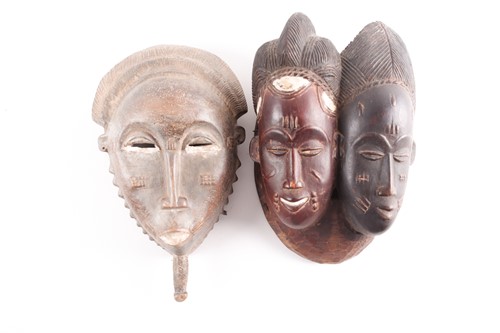 Lot 226 - A Baule Janus mask, Mblo, Ivory Coast, each...