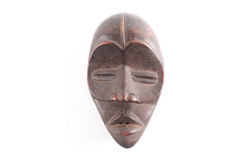 Lot 227 - A Dan mask, Ivory Coast/Liberia, the forehead...