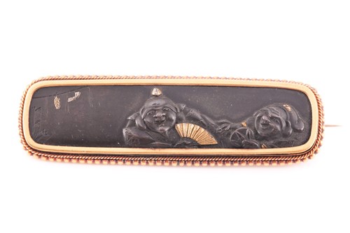 Lot 54 - A Japanese Shakudo brooch, the central panel...