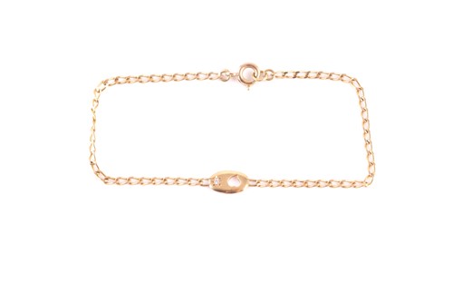 Lot 54 - An 18ct yellow gold bracelet, with a small...