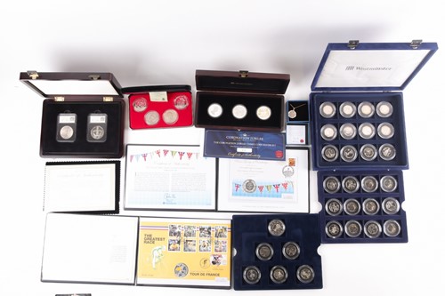 Lot 317 - Seven boxed commemorative coin sets,...