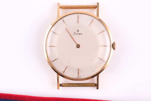 Lot 381 - A yellow metal Stowa watch, the plain cream...