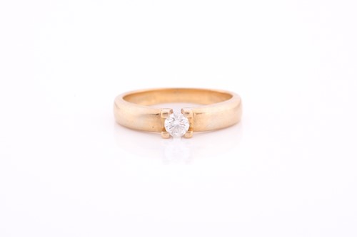 Lot 157 - An 18ct yellow gold and diamond ring, claw-set...