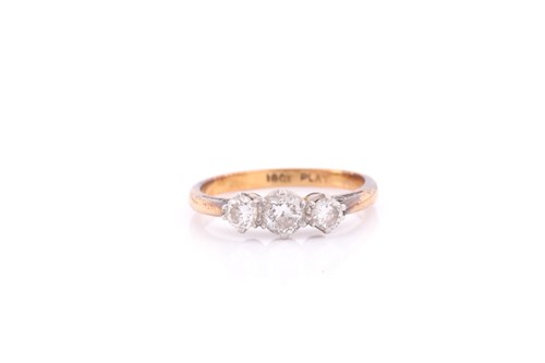 Lot 267 - A three stone half hoop diamond ring, the...