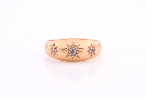 Lot 111 - A three stone gypsy set ring, the graduated...