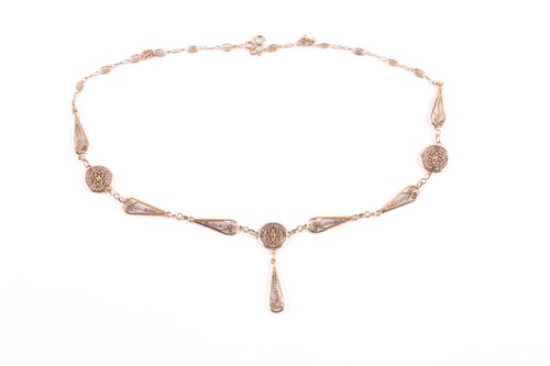 Lot 101 - A yellow metal and seed pearl drop pendant...