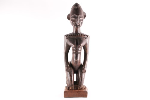Lot 247 - A Baule kneeling female figure, Blolo Bla,...