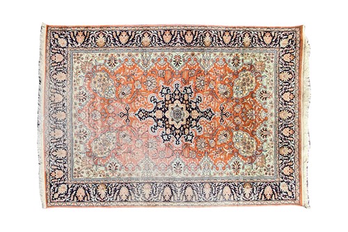 Lot 383 - A 20th-century brick red silk on silk Kashan...