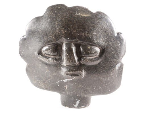 Lot 254 - An Inuit attributed hand carved serpentine...