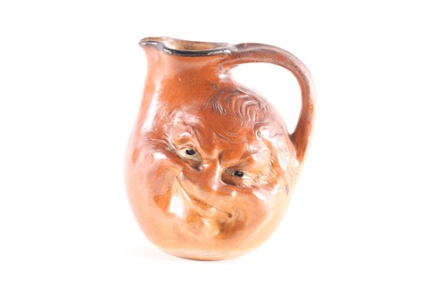 Lot 545 - A Martin Brothers large double-sided stoneware...