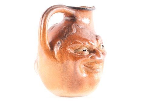 Lot 545 - A Martin Brothers large double-sided stoneware...