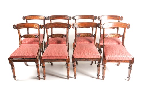 Lot 123 - A set of eight Regency brass inlaid and...