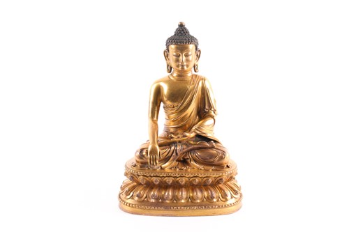 Lot 249 - A Chinese gilt bronze buddha, Qing, seated in...