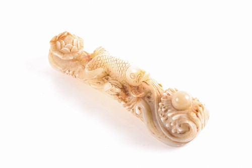 Lot 165 - A Chinese carved white jade figure of an...