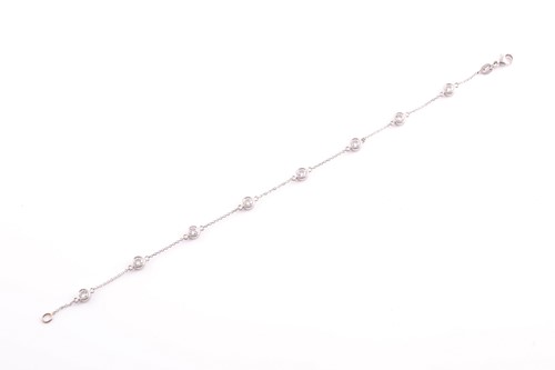 Lot 240 - A ladies platinum and diamond bracelet, the...