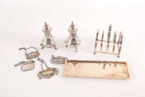 Lot 283 - A pair of 20th century silver peppers, London...