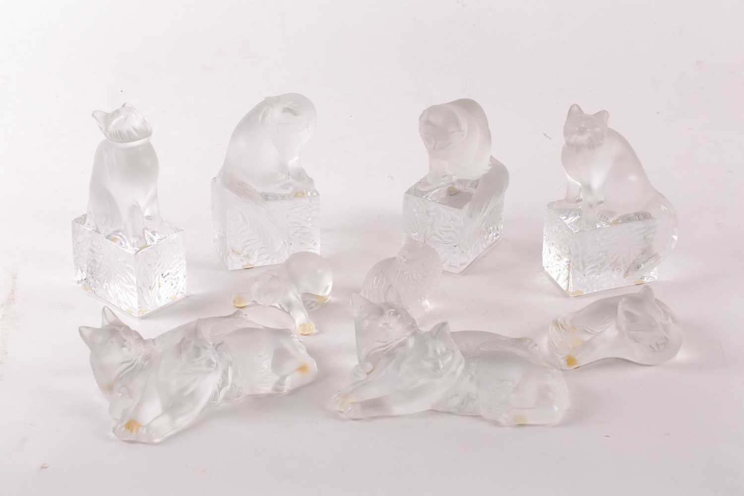 Lot 403 - A collection of eight Lalique frosted cat...