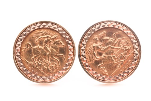 Lot 241 - A pair of yellow metal cufflinks each set with...