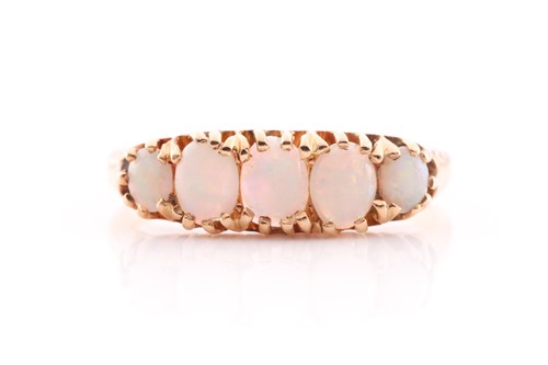 Lot 282 - An opal ring, set in 18 carat gold with five...