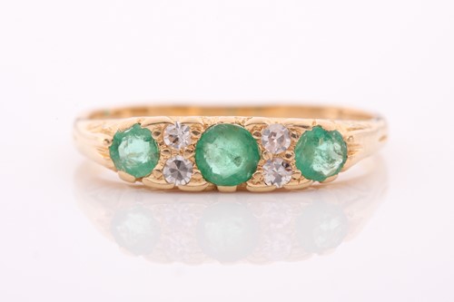 Lot 9 - An early 20th century gold, emerald and...