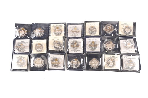 Lot 318 - Elizabeth II - twenty one silver proof crown...