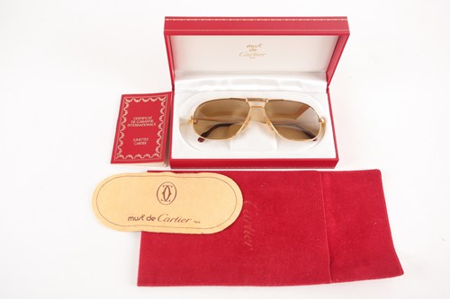 Lot 261 - A pair of Must de Cartier 1980s vintage gold...