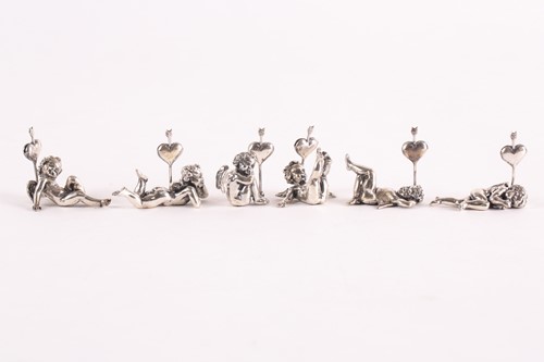 Lot 313 - A set of six modern cast silver cherub name...