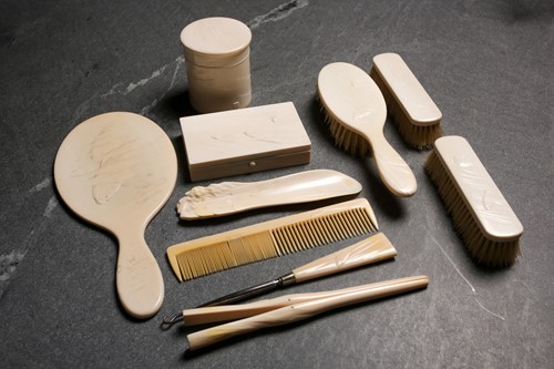 Lot 254 - A good Japanese ivory dressing table set,...