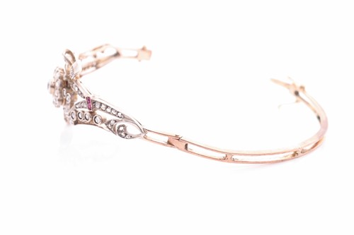 Lot 430 - A late Victorian diamond and ruby bangle, the...