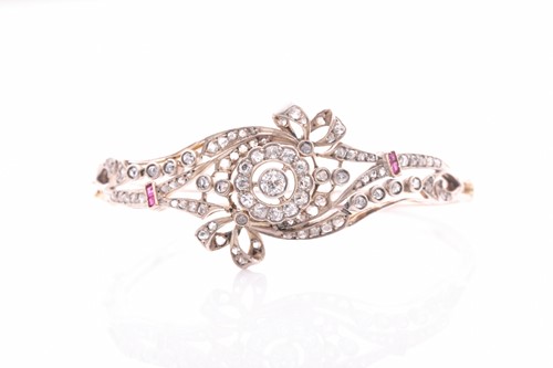 Lot 430 - A late Victorian diamond and ruby bangle, the...