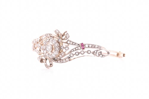Lot 430 - A late Victorian diamond and ruby bangle, the...