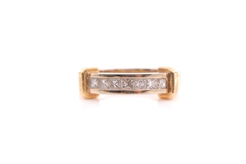 Lot 82 - A seven stone half hoop diamond ring; the...