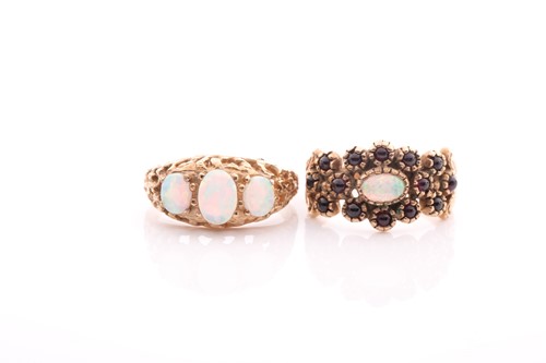 Lot 107 - A three stone half hoop opal ring, in carved 9...