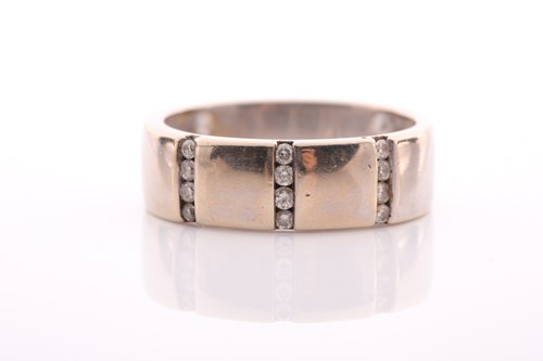 Lot 208 - An 18 carat white gold and diamond ring; the...
