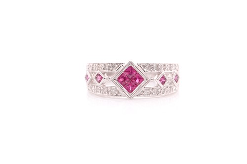 Lot 87 - An 18 carat white gold, ruby and diamond dress...