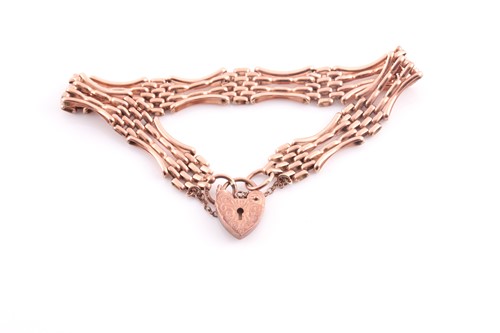 Lot 137 - A 9 carat rose gold gate link bracelet; with...