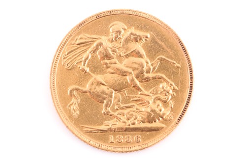 Lot 255 - A Victorian 1886 (M) young head gold sovereign.