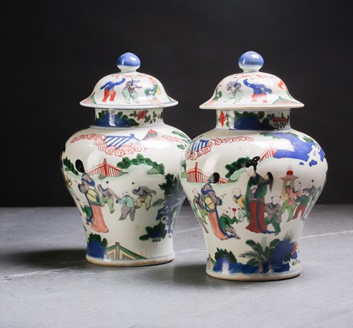 Lot 267 - A pair of Chinese Wucai vases and covers, Qing,...