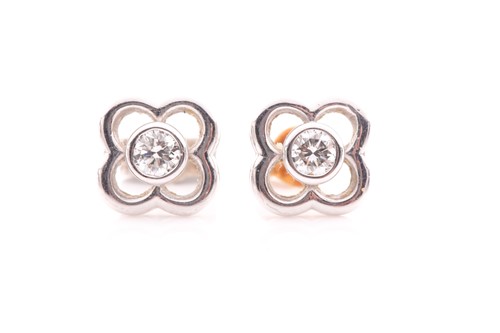Lot 79 - A pair of 18ct white gold and diamond floral...