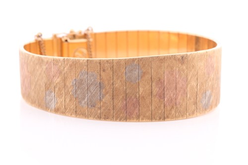 Lot 105 - An 18 carat gold bracelet, of slightly tapered...